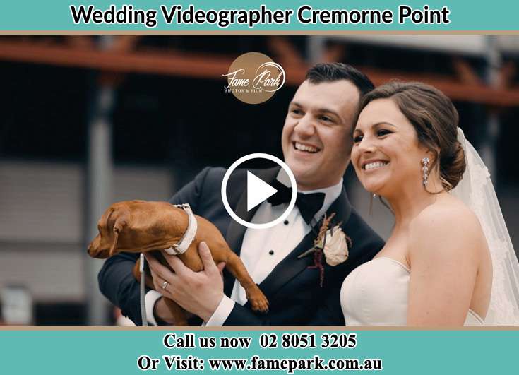 The Groom and the Bride posing for the camera with their dog Cremorne Point NSW 2090