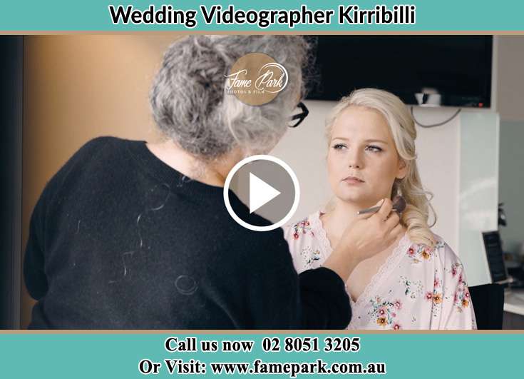 A woman applying makeup to the Bride's face Kirribilli NSW 2061