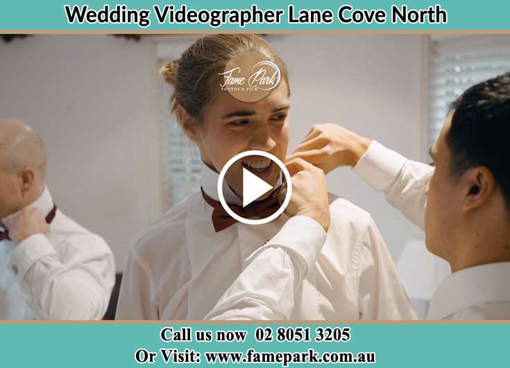 A groomsman fixing the Groom's tie Lane Cove North NSW 2066