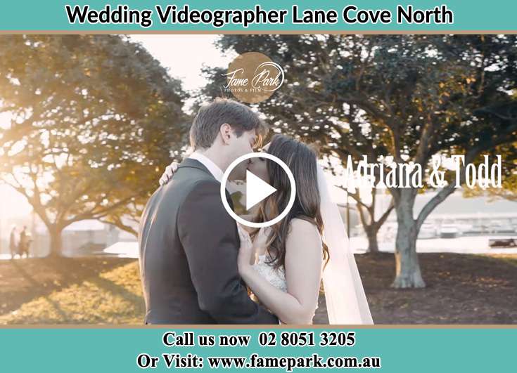 The newlyweds kissing in the park Lane Cove North NSW 2066